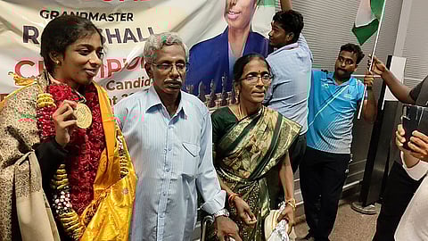 R Vaishali (L) poses with parents outside Terminal 2 of Chennai International Airport
