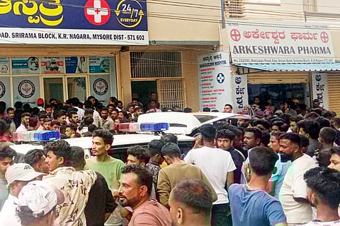 Public gather in front of a hospital in KR Nagar where the survivors are under treatment