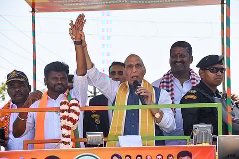 Defence Minister Rajnath Singh during a roadshow at Puliyangudi in Tenkasi district for the Assembly elections.