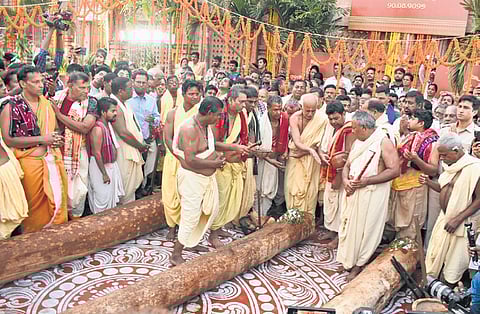 Servitors consecrating the wooden logs near Srimandir at Puri on Monday.