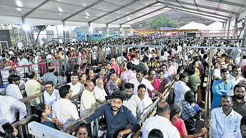 Devotees stand in long queues for the Nijaroopa Darshan of Sri Varaha Lakshmi Narasimha Swamy at Simhachalam on Monday