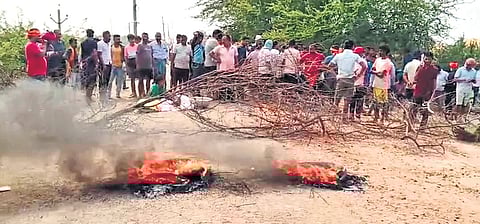 Villagers staging road blockade near Bahabalpur village on Monday.