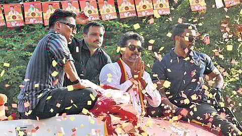 TVK leader Vijay canvassing for votes during his roadshow at Wireless Road in KK Nagar, Tiruchy, on Sunday.