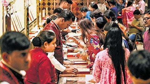 People buying gold from a jewellery shop in Bhubaneswar on the occasion of Akshaya Tritiya.