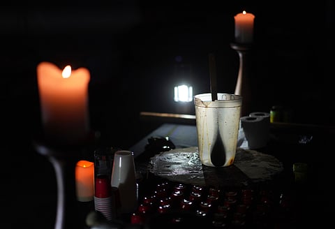 An empty pitcher and shot sized cups sit on an altar during an ayahuasca ceremony at a retreat in Hildale
