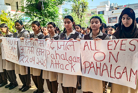 Students offer prayers and tributes to the victims of Pahalgam terror attack on its first anniversary, in Jammu, Wednesday, April 22, 2026.