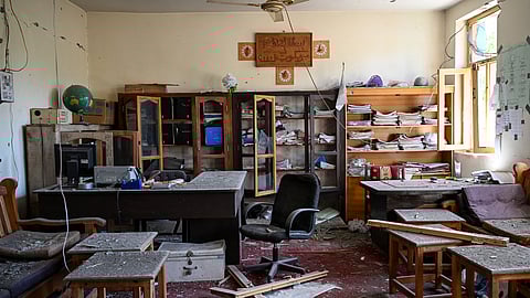 This photograph taken on April 13, 2026, shows a damaged school administration area after being struck by a Pakistani mortar shell during clashes between Taliban security personnel and Pakistani forces near the Durand Line in the Barikot village of Naray district, Kunar province.