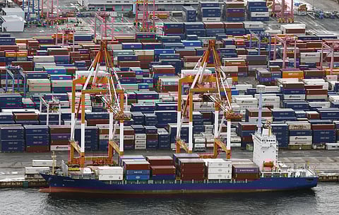 Containers are stacked at a port in Yokohama, near Tokyo on August 1, 2025.