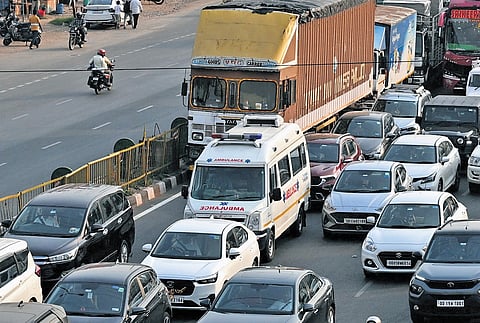 An ambulance stuck on NH-16 at Palasuni following a massive traffic jam after a truck caught fire on Palasuni overbridge in Bhubaneswar