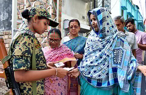 Security check underway at a polling station during voting in the first phase of the West Bengal Assembly elections, in Murshidabad, Thursday, April 23, 2026.