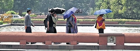 Visitors take a stroll at Kartavya Path on a hot summer day on Friday | Parveen Negi