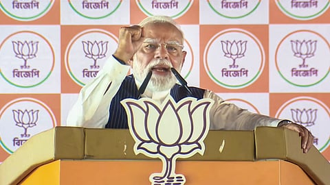Prime Minister Narendra Modi addresses the gathering during a campaign for the West Bengal Assembly elections, in Dum Dum, North 24 Parganas district.
