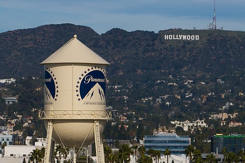The Paramount Pictures water tower is seen in Los Angeles, Dec. 18, 2025, with the Hollywood sign in the distance