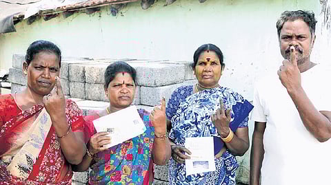 Residents of Ekanapuram in Kancheepuram district, who have been opposing the greenfield airport project, after casting their votes on Thursday.
