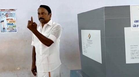 TVK leader and candidate from Gopichettipalayam constituency, KA Sengottaiyan casts his vote and shows his inked finger, at a polling station in Erode.