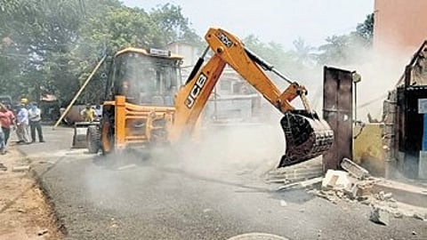 Bhubaneswar Development Authority removes illegal constructions over drains on Friday.