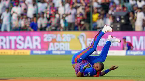 Delhi Capitals' Lungi Ngidi loses balance after an unsuccessful catch attempt during the Indian Premier League (IPL) 2026 T20 cricket match.