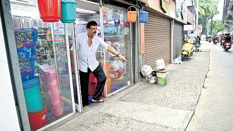 Shops near Elamkulam metro station sitting below road level