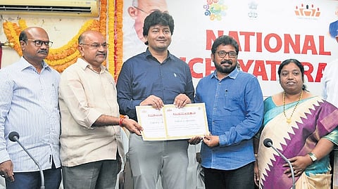 Panchayati Raj Director M Krishna Teja felicitating persons who rendered outstanding service to the sector in Vijayawada on Friday.