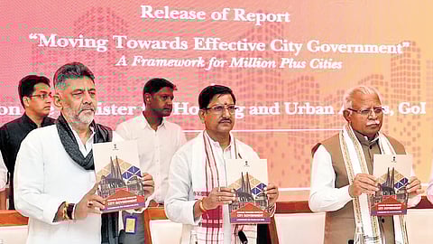 Deputy Chief Minister DK Shivakumar and Union Minister Manohar Lal Khattar (right) release a report ‘Moving Towards Efficient City Government: A Framework for Million Plus Cities’ during the 56th Foundation Day and Symposium organised by the Ministry of Housing and Urban Affairs in New Delhi on Saturday.