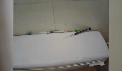 Used syringes and needles found in a restroom at MG Stadium in Tumakuru.