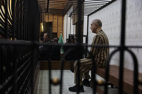 Atef Najib, former head of the Political Security Branch in the Daraa area during Bashar Assad's rule, sits in the defendants' cage during a trial session at the Palace of Justice in Damascus, Syria, Sunday, April 26, 2026.