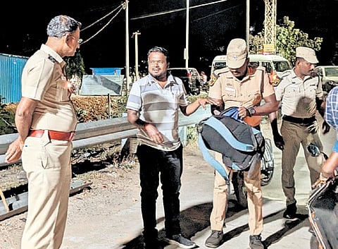 Police personnel conduct vehicle checks at PEW checkpost in Allpettai.