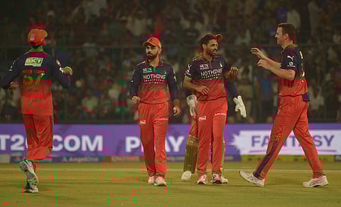 Bhuvneshwar Kumar (2nd from right) and Josh Hazlewood (right) shared seven wickets between themselves on Monday