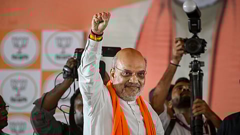 Union Home Minister Amit Shah greets the gathering during a public meeting amid the ongoing West Bengal Assembly elections, at Ranaghat, in Nadia district, Sunday, April 26, 2026.