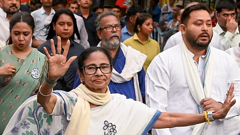 West Bengal Chief Minister and Trinamool Congress supremo Mamata Banerjee with RJD leader Tejashwi Yadav and others during a roadshow amid the ongoing West Bengal Assembly elections, in Kolkata, Monday, April 27, 2026.