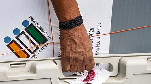A polling official carries sealed election materials on the eve of voting in the second phase of the West Bengal Assembly elections, in Kolkata, Tuesday, April 28, 2026