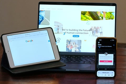 The home pages of Meta, Google and TikTok are displayed on devices in Sydney