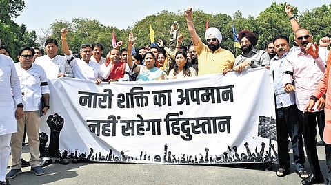 CM Rekha Gupta along with BJP MLAs during the protest on Tuesday