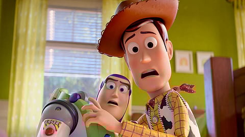 This image released by Disney shows characters Buzz Lightyear, voiced by Tim Allen, left, and Woody, voiced by Tom Hanks, in a scene from "Toy Story 5."