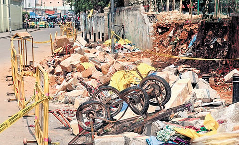 A day after the Bowring and Lady Curzon Hospital wall collapsed due to heavy rains, the road has been barricaded.