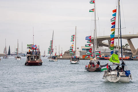 Boats carrying activists and humanitarian aid for Palestinians in Gaza reposition in the port during a symbolic send-off as part of the Global Sumud Flotilla, in Barcelona, Spain, Sunday, April 12, 2026.