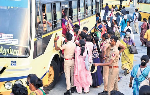 People heading to Tiruvanamalai board a bus at Kilambakkam