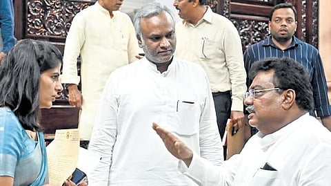 Ministers MB Patil and Priyank Kharge leave after the cabinet meeting at Vidhana Soudha in Bengaluru on Thursday.