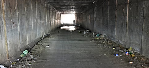 Broken liquor bottles, discarded snack packets and eatables scattered in Odathurai subway making it unsafe and unhygienic.