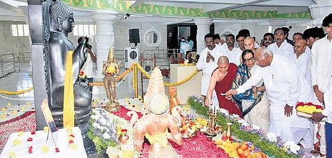 AICC chief Mallikarjun Kharge and his wife Radhabai light a lamp in front of a Buddha statue on the occasion of Buddha Purnima in Kalaburagi on Friday