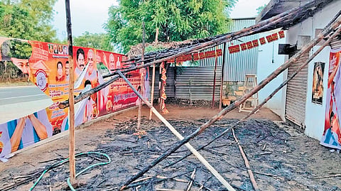 Charred remains of the pandal that housed a TVK election office at Pettavaithalai in Tiruchy after it was set on fire by miscreants on Friday.