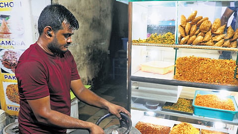 A man brings out a commercial LPG cylinder at an eatery in Hyderabad on Friday.