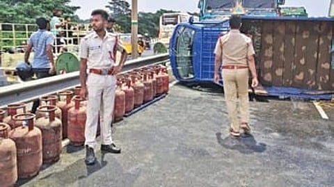 As the mini-truck overturned, more than 70 gas cylinders spilled onto the road, bringing traffic towards Khandagiri Square to a complete halt.