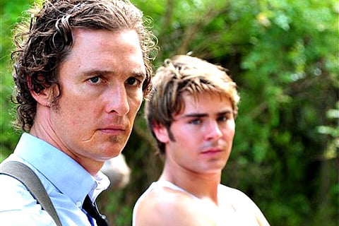 This film image released by Millennium Films shows Matthew McConaughey, left, and Zac Efron in a scene from "The Paperboy." (AP Photo/Millennium Films, Anne Marie Fox)