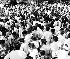 Villagers of Challagundla gather to have a look at the body of Moddu Seenu which was brought to the village on Monday.