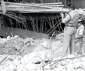 Police at the Prestige building in Whitefield which collapsed recently. The body of a missing labourer was found in the debris/Nagaraja gadekal