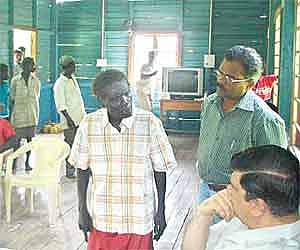 Lt Governor of Andaman and Nicobar Islands Bhopinder Singh (right) discussing the tragedy with the members of the Onge tribe at Dugong Creek on Wednes