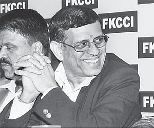 Columnist S Gurumurthy at a talk on 'global financial crisis-Impact on India, in Bangalore on Tuesday. FKCCI president D Muralidhar and vice-presiden