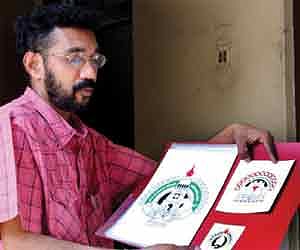 Santosh Chirakkara with the logos he designed for the Kollam, Kannur and the present editions of the State School Kalolsavam.