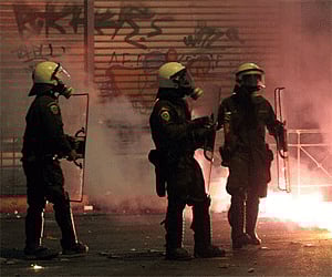 Riot police are attacked with firebombs thrown by rioters near the National Technical University of Athens Tuesday, Dec. 9, 2008 (Photo: AP)